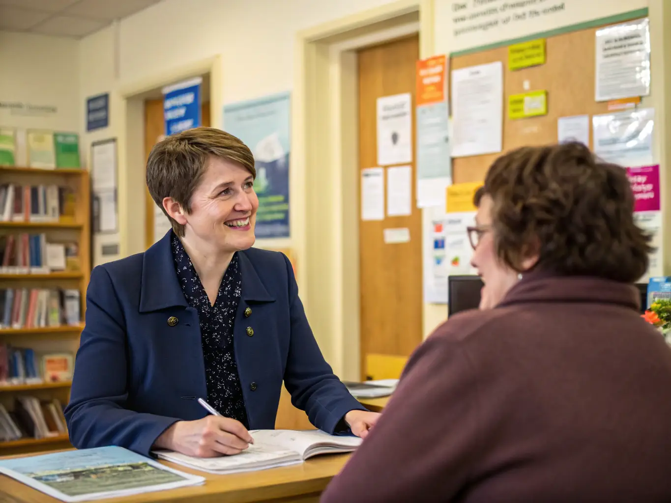 A supportive social worker providing guidance and assistance to a patient, highlighting AHNAC's commitment to holistic care.